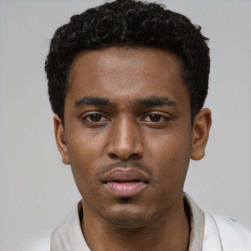 Neutral black young-adult male with short  black hair and brown eyes