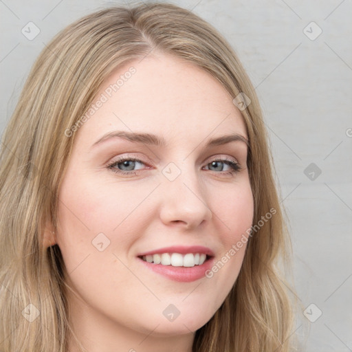 Joyful white young-adult female with long  brown hair and green eyes