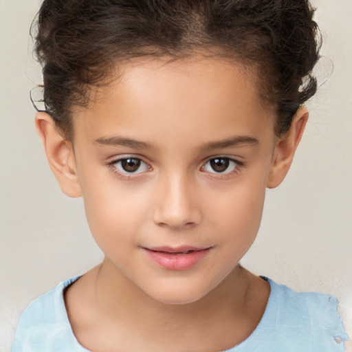 Joyful white child female with short  brown hair and brown eyes