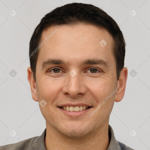 Joyful white adult male with short  brown hair and brown eyes