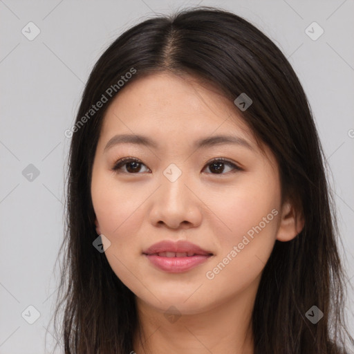 Joyful asian young-adult female with long  brown hair and brown eyes