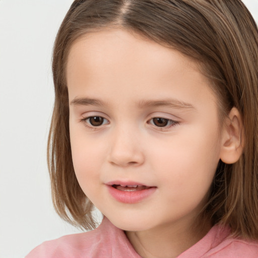 Joyful white child female with long  brown hair and brown eyes