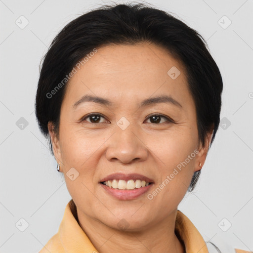 Joyful white adult female with medium  brown hair and brown eyes