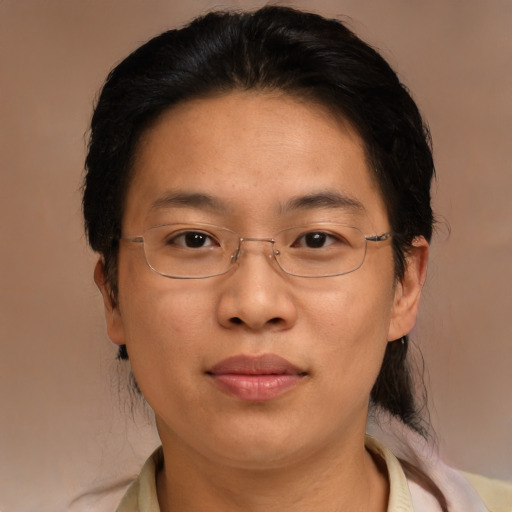 Joyful asian adult female with medium  brown hair and brown eyes