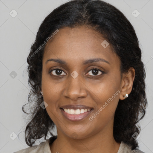 Joyful black young-adult female with medium  brown hair and brown eyes