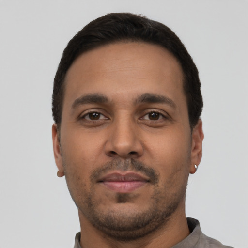Neutral latino young-adult male with short  black hair and brown eyes