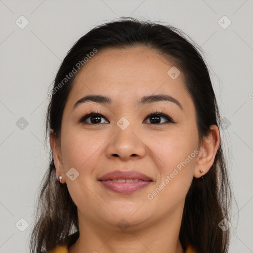 Joyful latino young-adult female with medium  brown hair and brown eyes