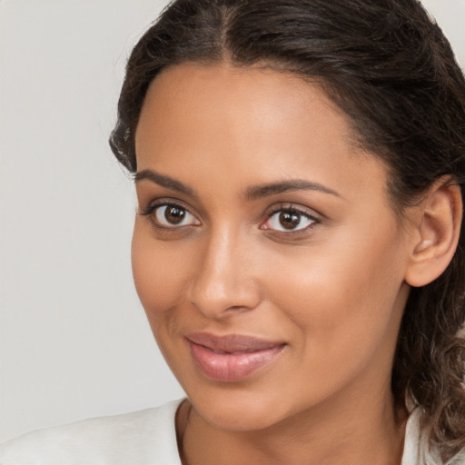 Joyful white young-adult female with medium  brown hair and brown eyes