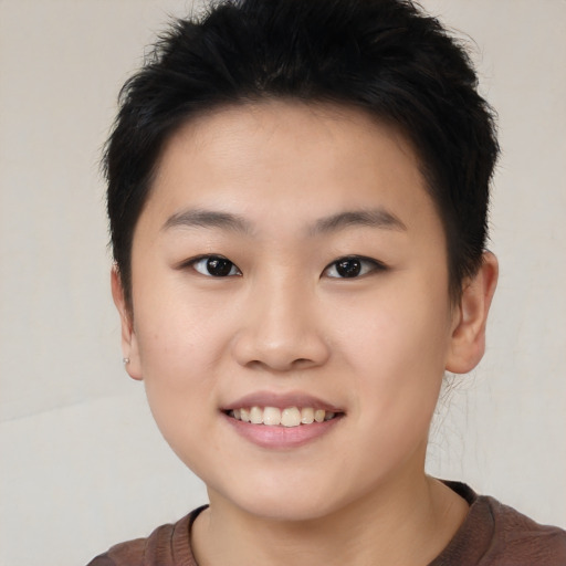 Joyful white young-adult female with short  black hair and brown eyes