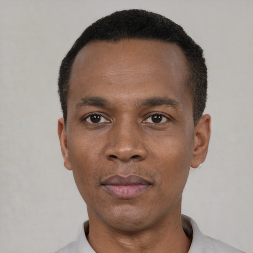 Neutral black young-adult male with short  black hair and brown eyes