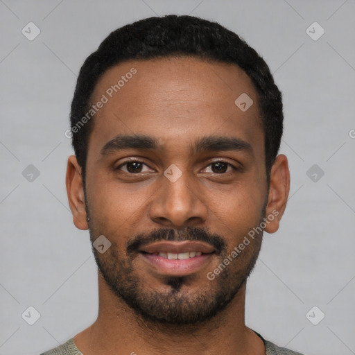 Joyful black young-adult male with short  black hair and brown eyes