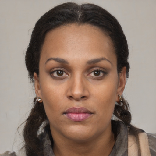 Neutral black adult female with long  brown hair and brown eyes