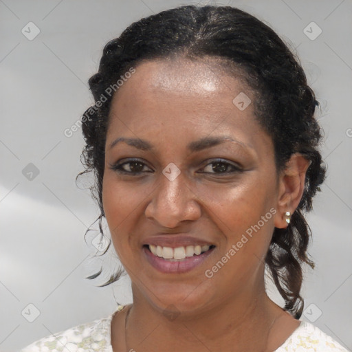 Joyful black young-adult female with medium  brown hair and brown eyes
