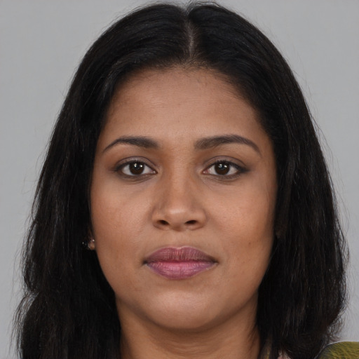 Joyful asian young-adult female with long  brown hair and brown eyes