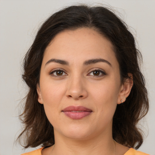Joyful white young-adult female with medium  brown hair and brown eyes