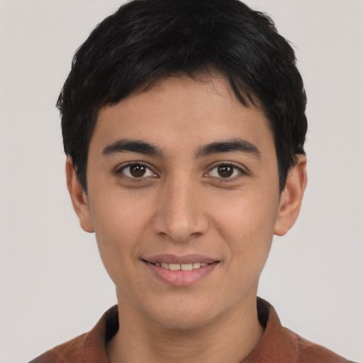 Joyful asian young-adult male with short  brown hair and brown eyes