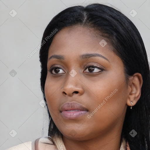 Neutral black young-adult female with long  black hair and brown eyes