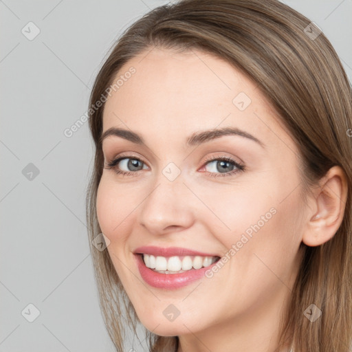 Joyful white young-adult female with long  brown hair and grey eyes