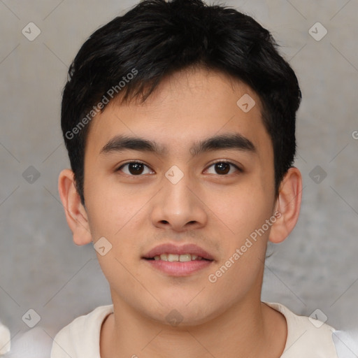 Joyful asian young-adult male with short  brown hair and brown eyes