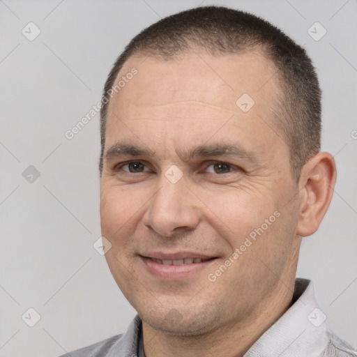 Joyful white adult male with short  brown hair and brown eyes