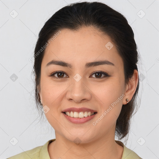 Joyful latino young-adult female with medium  brown hair and brown eyes