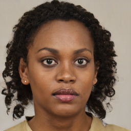 Neutral black young-adult female with medium  brown hair and brown eyes