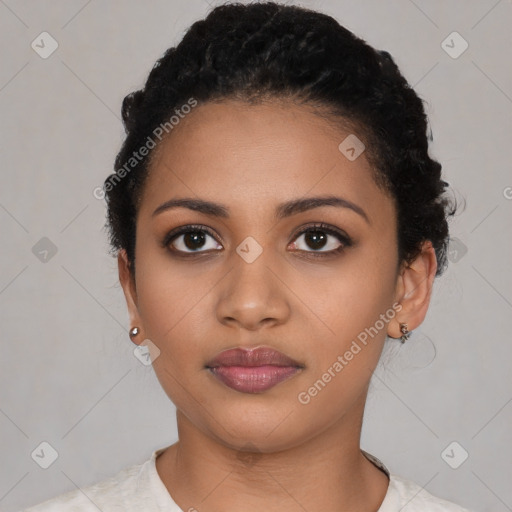 Joyful latino young-adult female with short  black hair and brown eyes