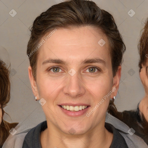 Joyful white adult female with medium  brown hair and brown eyes