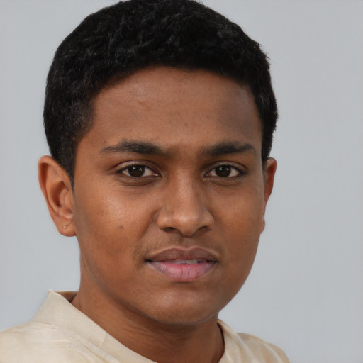 Joyful latino young-adult male with short  brown hair and brown eyes