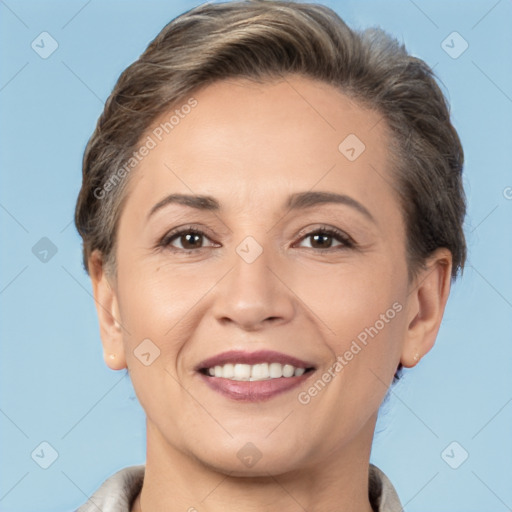 Joyful white adult female with short  brown hair and brown eyes