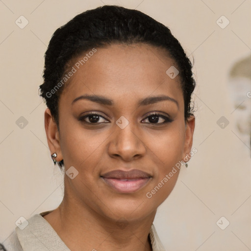Joyful black young-adult female with short  black hair and brown eyes