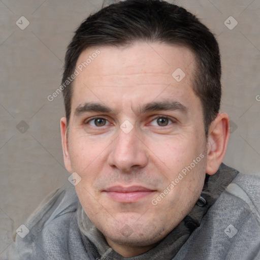 Joyful white adult male with short  brown hair and brown eyes