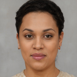 Joyful latino young-adult female with short  brown hair and brown eyes