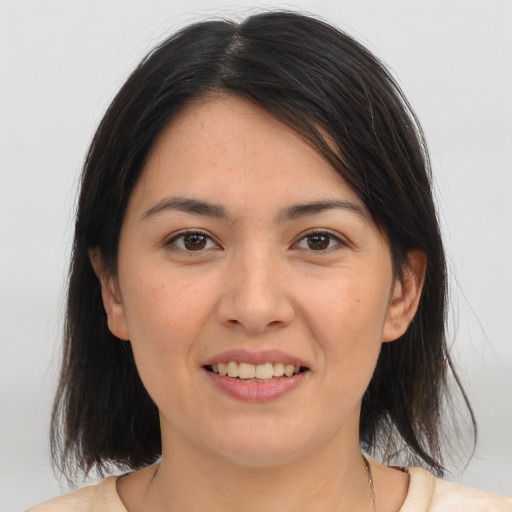 Joyful white young-adult female with medium  brown hair and brown eyes