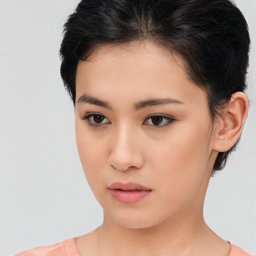 Neutral asian young-adult female with short  brown hair and brown eyes