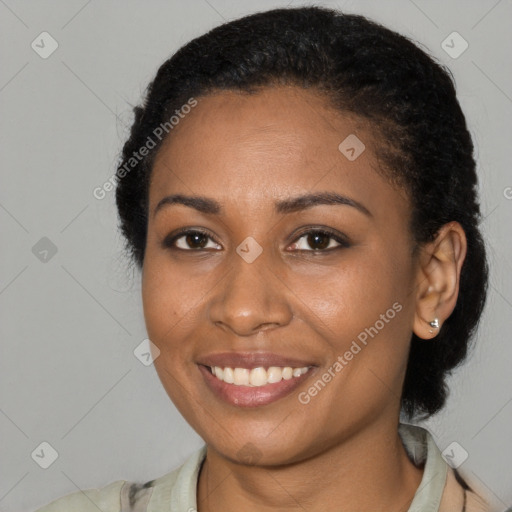 Joyful black young-adult female with short  brown hair and brown eyes