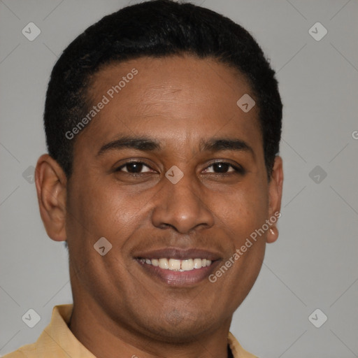 Joyful black young-adult male with short  black hair and brown eyes