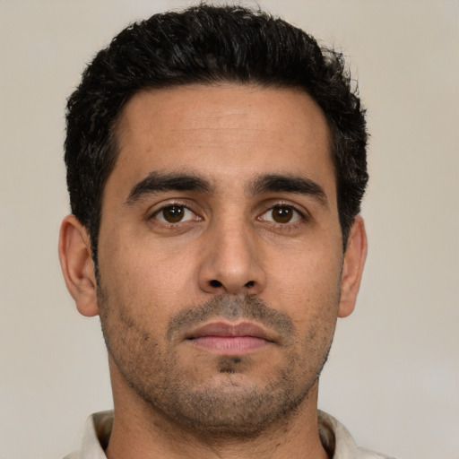 Neutral latino young-adult male with short  black hair and brown eyes