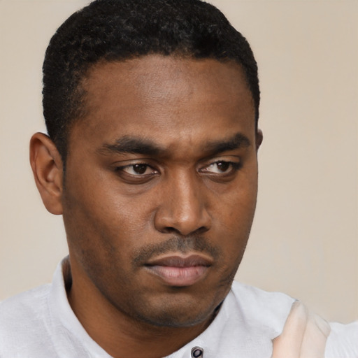 Neutral black young-adult male with short  black hair and brown eyes