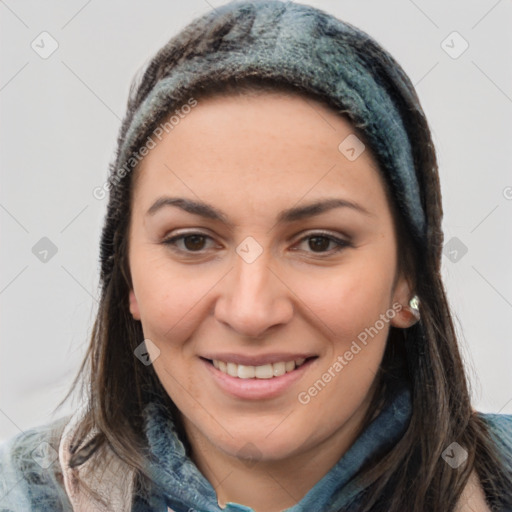 Joyful latino young-adult female with medium  brown hair and brown eyes