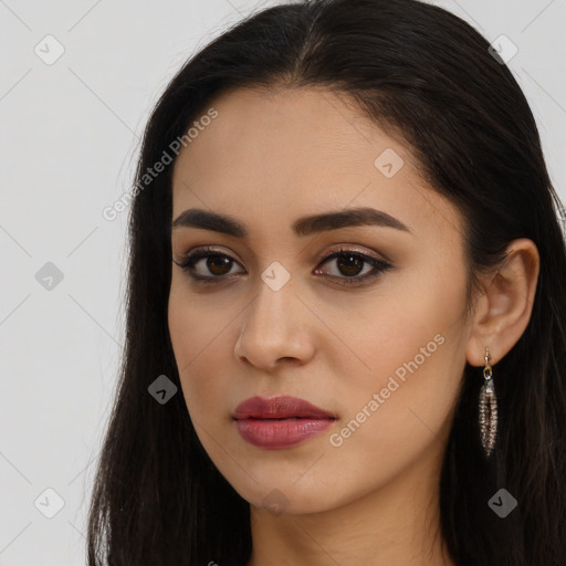 Joyful latino young-adult female with long  brown hair and brown eyes