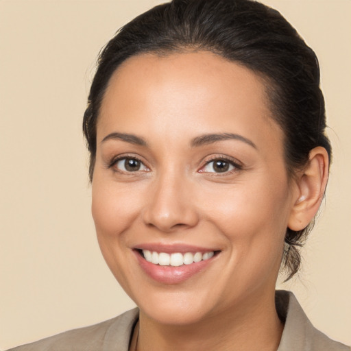 Joyful white young-adult female with medium  brown hair and brown eyes