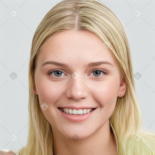 Joyful white young-adult female with long  brown hair and blue eyes