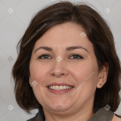 Joyful white adult female with medium  brown hair and brown eyes