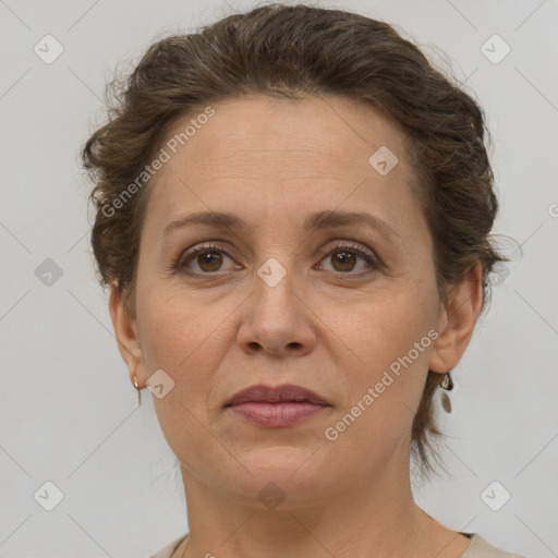 Joyful white adult female with short  brown hair and brown eyes