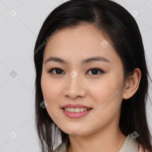 Joyful asian young-adult female with long  brown hair and brown eyes