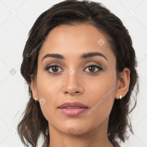 Joyful latino young-adult female with medium  brown hair and brown eyes