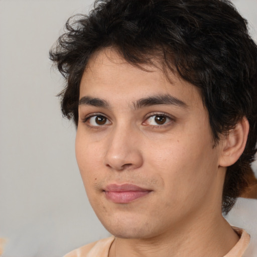 Joyful white young-adult male with medium  brown hair and brown eyes