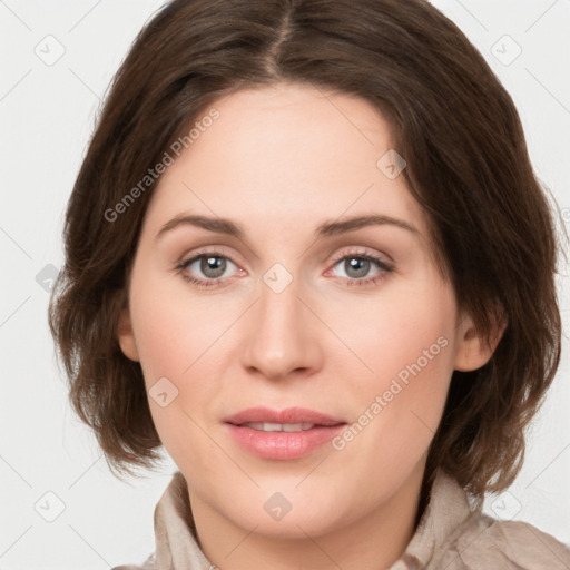 Joyful white young-adult female with medium  brown hair and green eyes