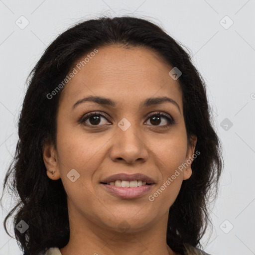 Joyful latino young-adult female with long  brown hair and brown eyes